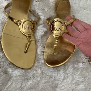 Michael Kors gold metallic tong sandals